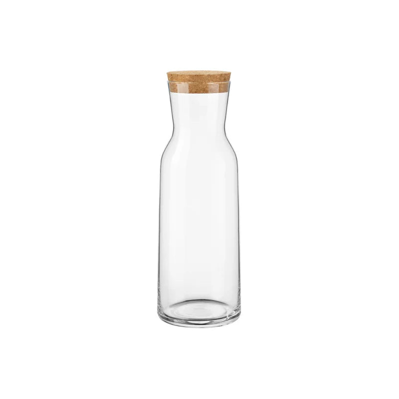 Clear glass carafe with a wooden lid on a white background