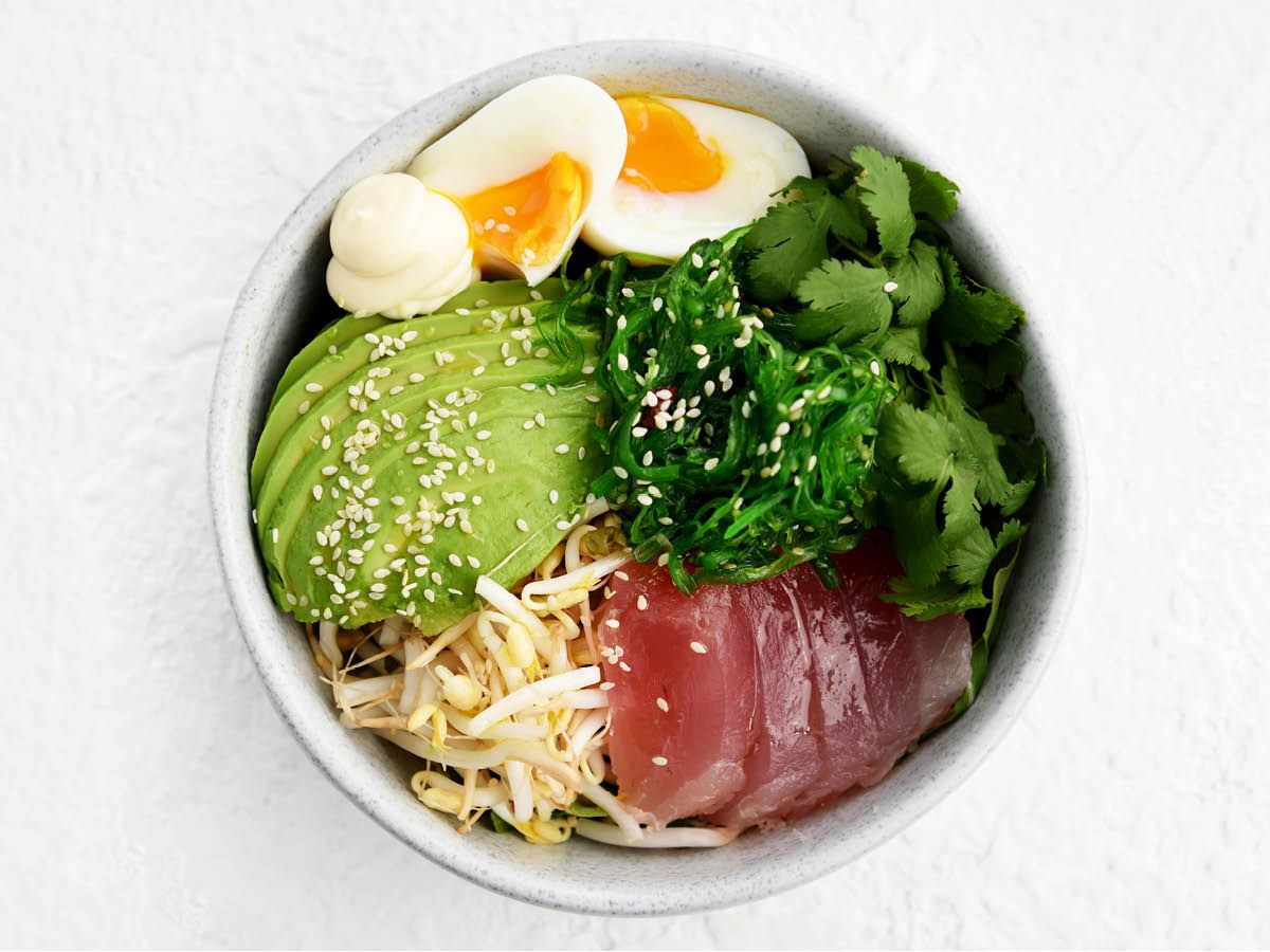 Light gray speckled bowl with salad feature on white background