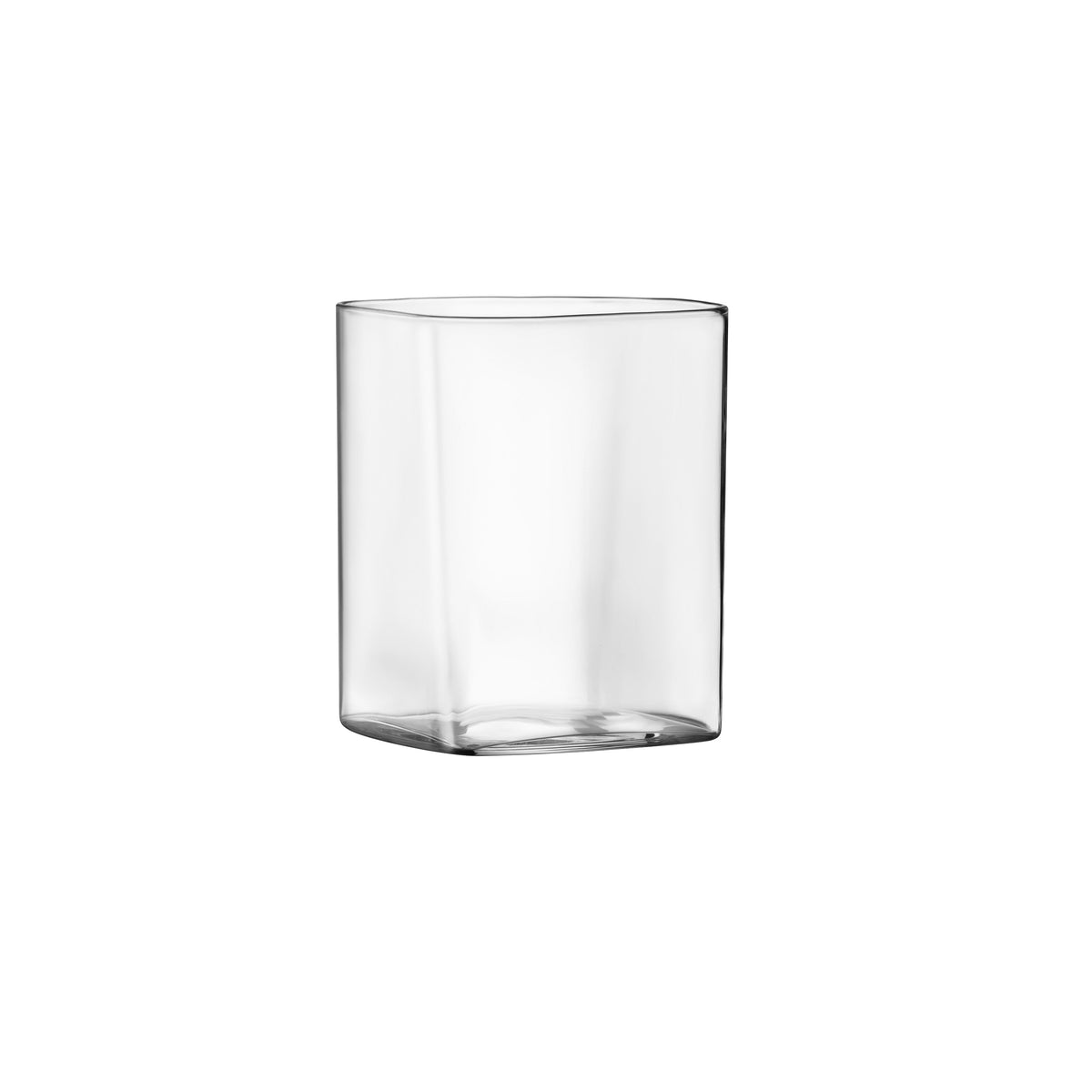 A small, clear square shaped tumbler glass presented on a white background
