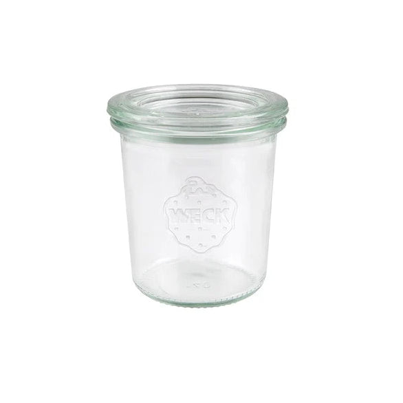 Medium sized glass jar with lid presented on a white background