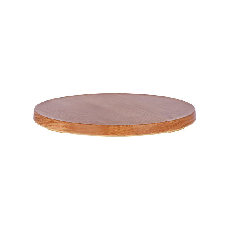 Round wooden cutting board with pinkish-brown top and brown edge on a white background