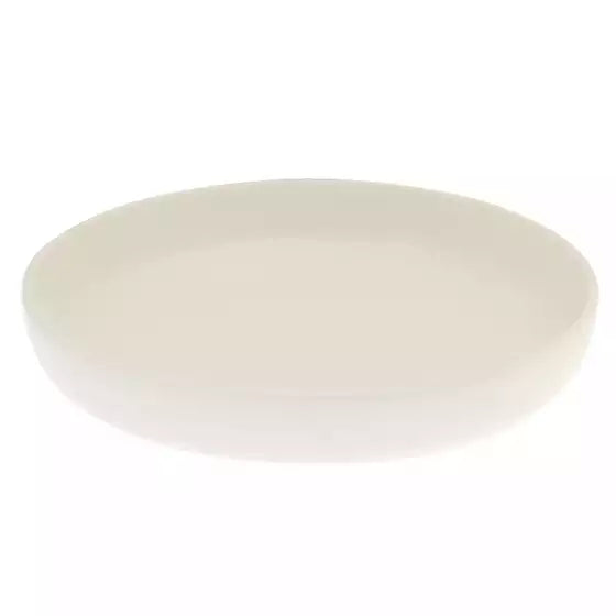 An ivory coloured deep round plate on a white background