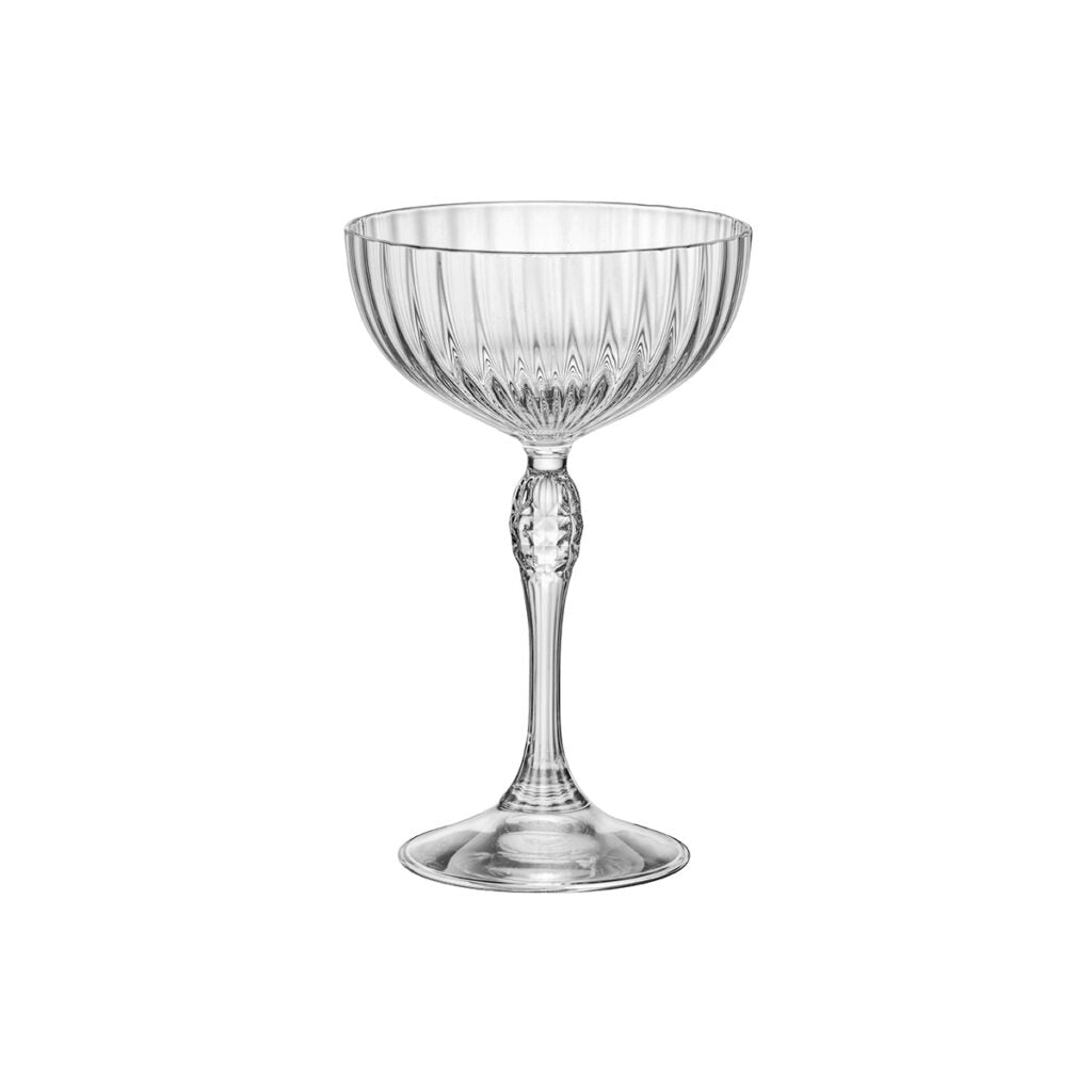A clear crystal designed champagne coupe presented on a white background