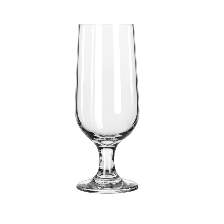 A tall clear stemmed beer glass on a white background