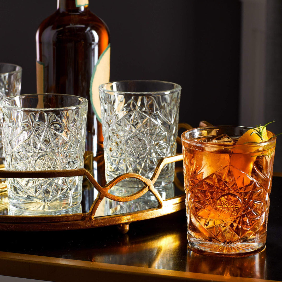 Crystal cut glasses with liquid on bar