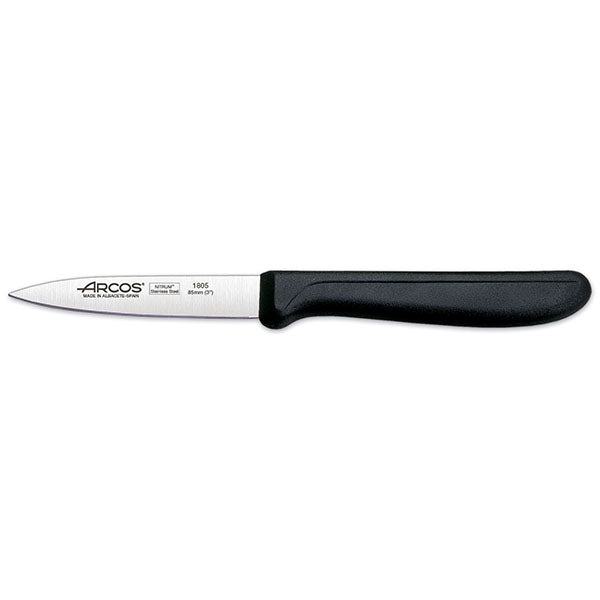 Black handled pairing knife on white background