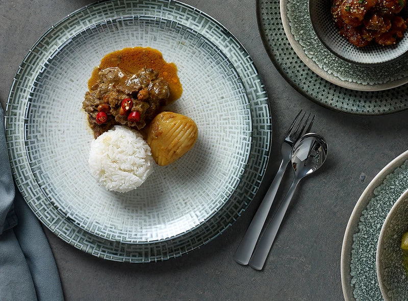 Tiles blue plate with meat, potato and rice with matching Strand Cutlery