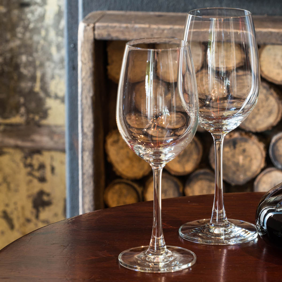 One White and one red wine glass on a round table