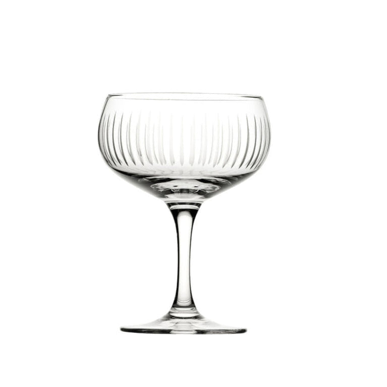 A clear glass cocktail cup with vertical cut lines pattern, stem included, against a white background.