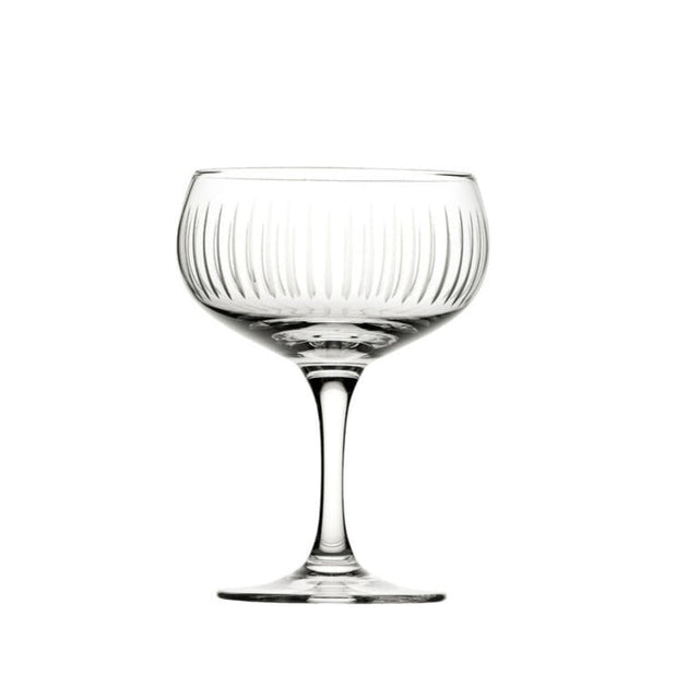 A clear glass cocktail cup with vertical cut lines pattern, stem included, against a white background.