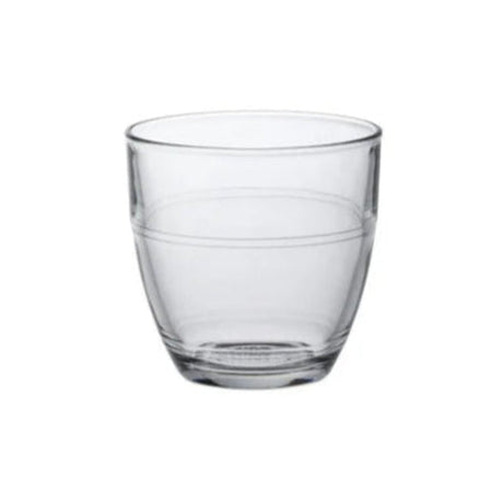A clear glass tumbler with a simple design, showing vertical seams where the glass is constructed from multiple pieces.