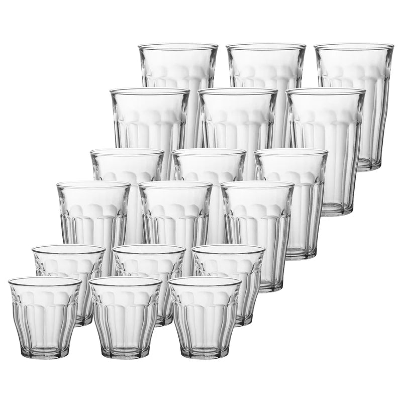 Set of clear glass tumblers on a white background
