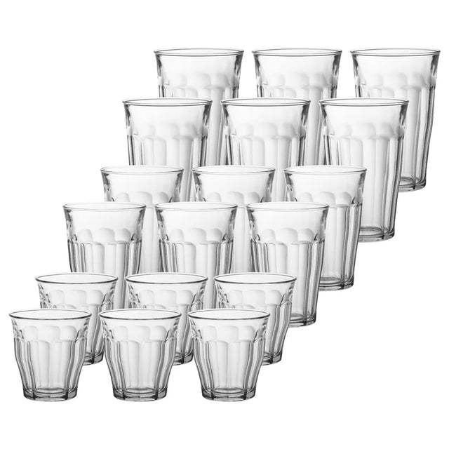 Set of clear glass tumblers on a white background
