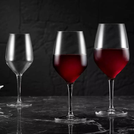 Red wine glasses on black backround