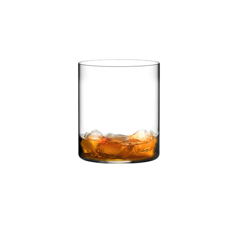 Small whiskey tumbler with brown liquid on a white background