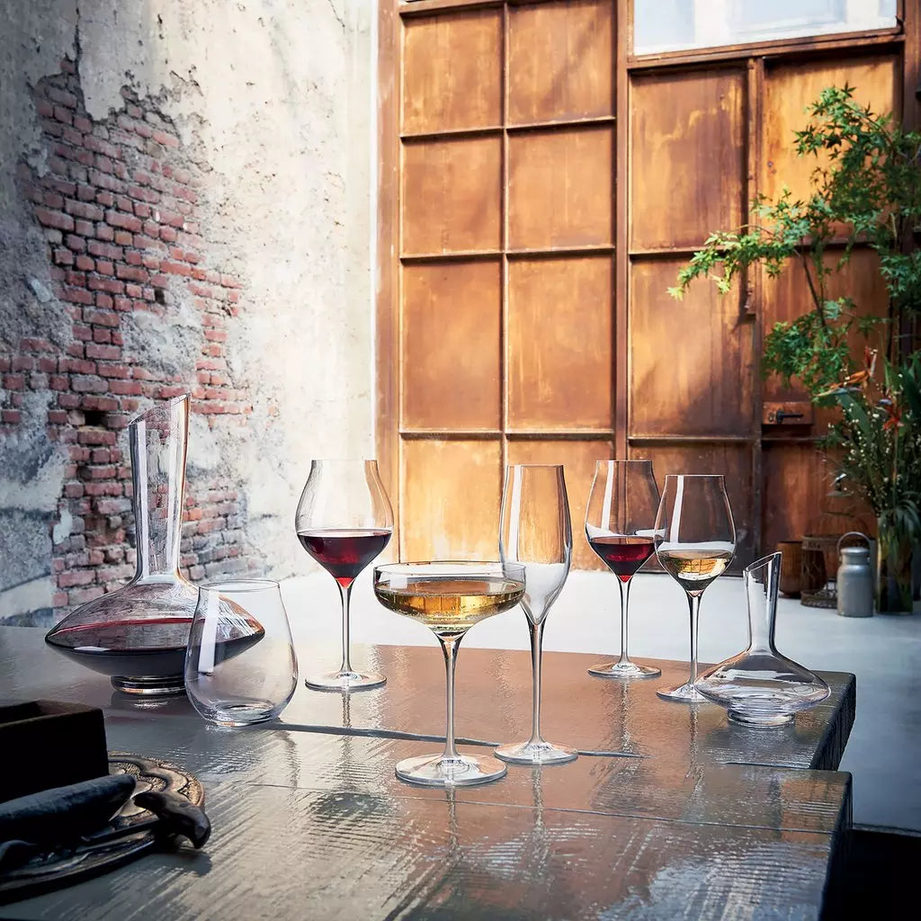 Range of glassware with liquid on a table setting