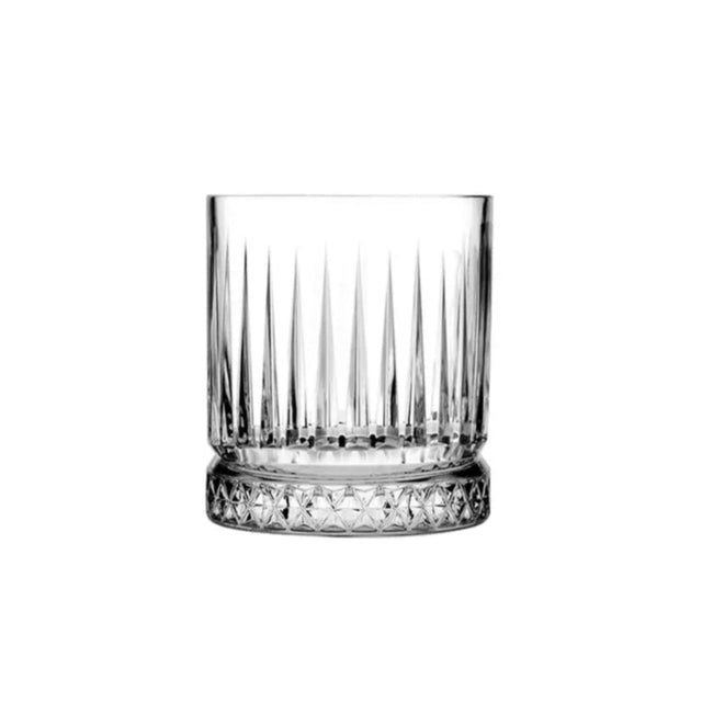 A clear glass tumbler with vertical cuts and details resembling a diamond cut design.