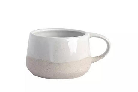 White coffee cup on white background