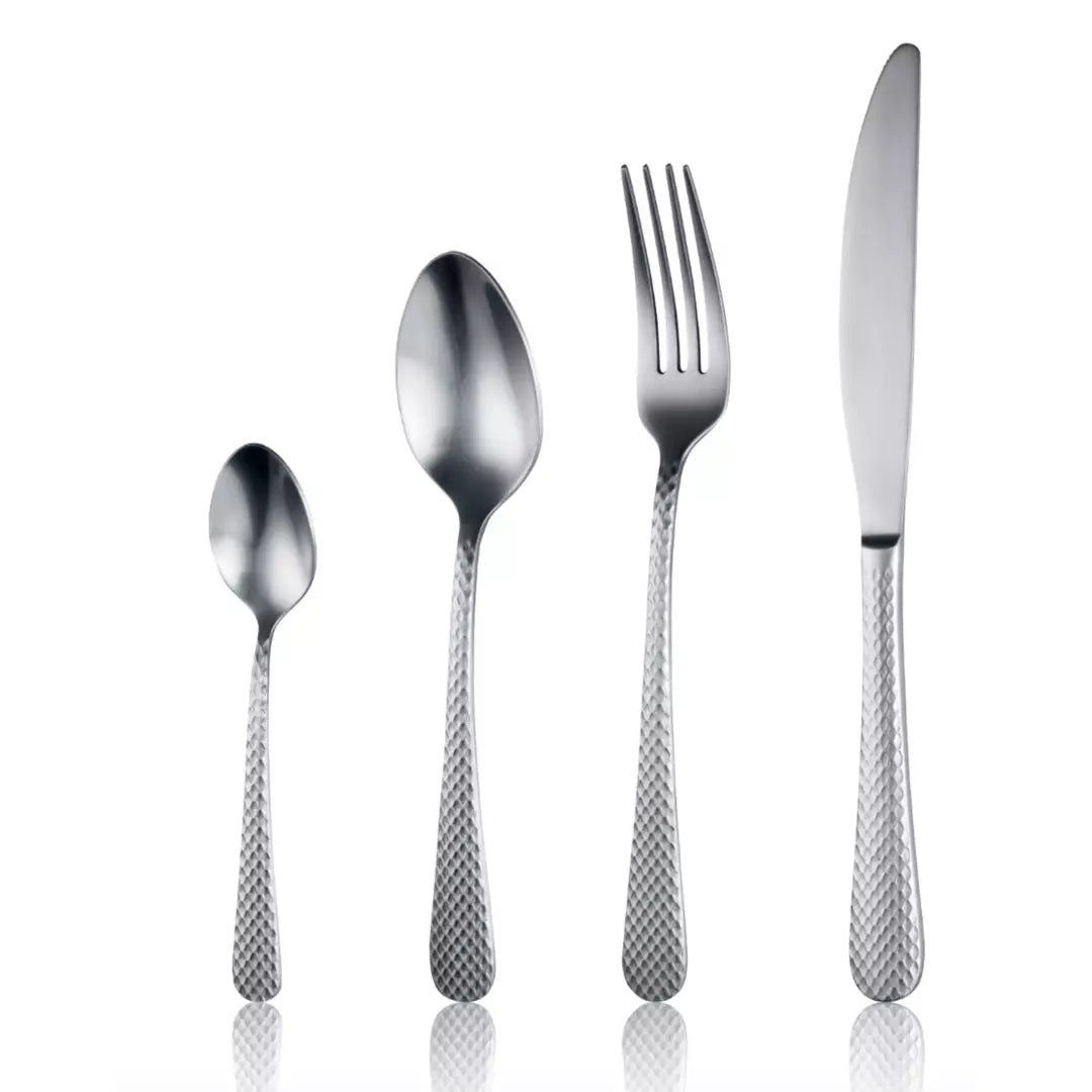 Set of silver cutlery including a knife, fork, and two spoons on a white background