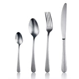 Set of silver cutlery including a knife, fork, and two spoons on a white background