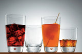 Four dimple shaped tumblers, two late and two small with liquids presented on a light grey background