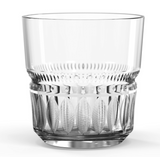 A clear glass with a geometric pattern on the upper part, intended for serving spirits or mixed beverages.