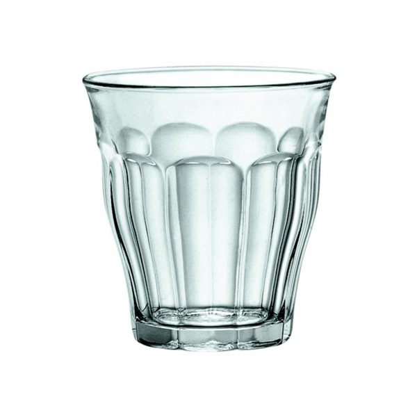 A clear glass tumbler with a textured pattern.
