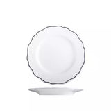 White scalloped round plate with wide rim and blue band on a white background