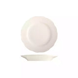 White small scalloped side plate with wide rim on white background