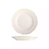 Small white scalloped rimmed plate on white background