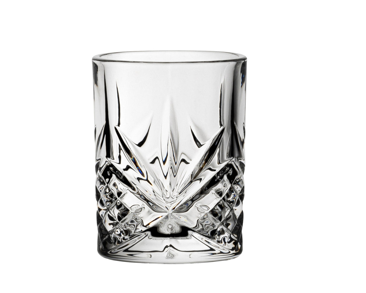 A clear shot glass with a geometric pattern.