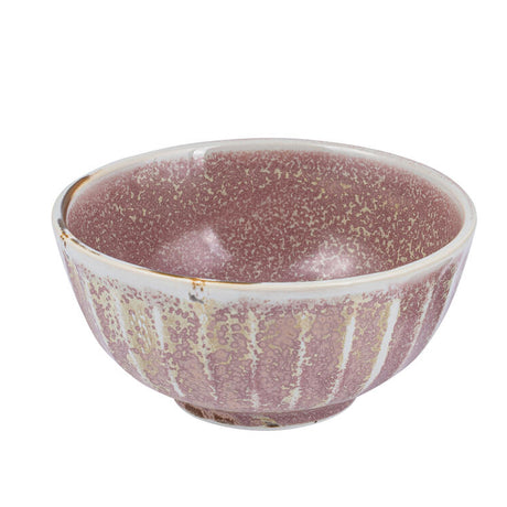 A round, pink porcelain bowl with a scallop design and a metallic speckled finish.