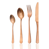 Four piece copper coloured cutlery on white background