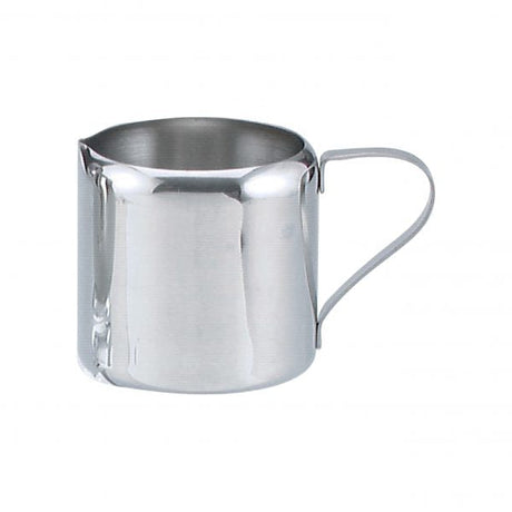 Stainless steel creamer with handle on white background