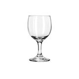 Clear short stemmed wine glass on white background