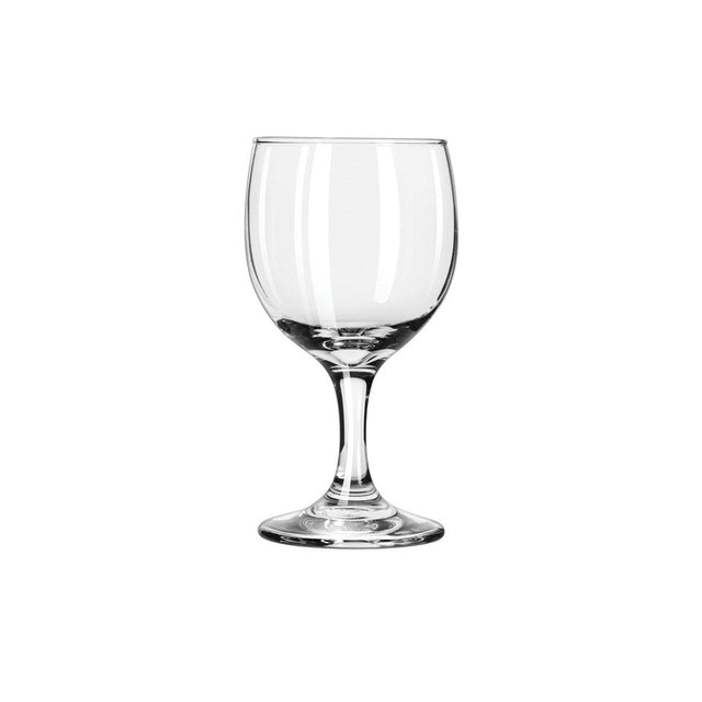 Clear short stemmed wine glass on white background