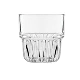 Clear tumbler  glass with rippled bottom on white background
