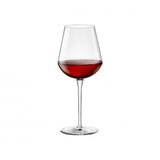 Large wine glass with liquid on a white background