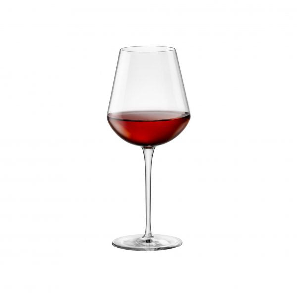 Large wine glass with liquid on a white background