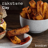 Table setting photo of a bowls with hot chips and a plate with burgers and chips