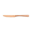 Copper coloured Table Knife on white background