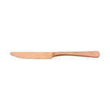 Copper coloured Table Knife on white background