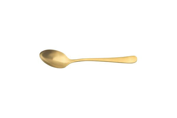 Gold plated tea spoon on white background
