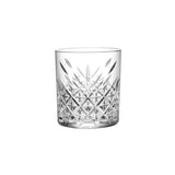 Clear tumbler glass with geometric design on white background