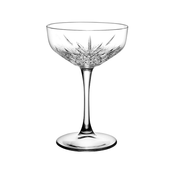 Clear champagne saucer on white background