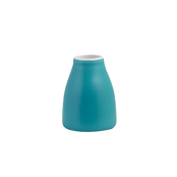 A small blue Creamer with a white lip presented on a white background