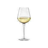 Small white wine glass with liquid on a white background