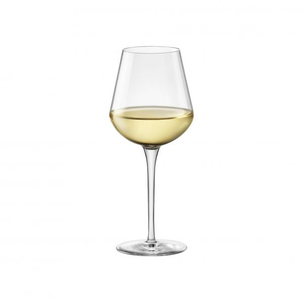 Small white wine glass with liquid on a white background